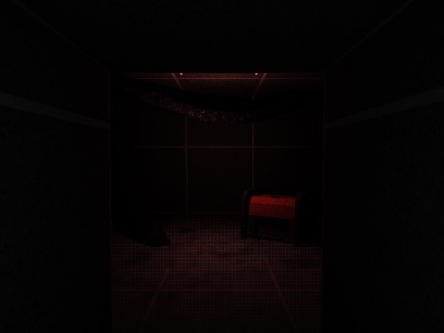 A dark room with a generator lit with red light.